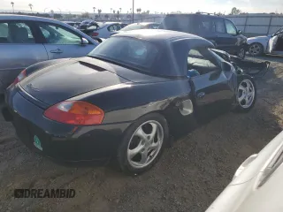 2000 Porsche Boxster z VIN WP0CA2984YU627674, wystawiony jako Copart lot #86027054 z przebiegiem 112 153 mil mil oraz Szkoda całkowita • Salvage title. Historia ofert i sprzedaży dostępna na DreamBid. Obrazek 3.