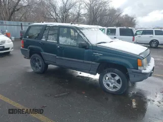 1993 Jeep Grand Cherokee Laredo with VIN 1J4GZ58Y9PC583439, listed as a IAAI auction lot 41794732 with 211,691 mi miles. Bid and sale history available at carsss.com. Image 1.
