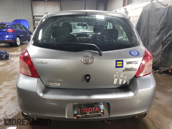 2007 Toyota Yaris with VIN JTDJT923275114473, listed as a Copart auction lot 52242355 with 137,963 mi miles and Salvage Title. Bid and sale history available at carsss.com. Image 6.