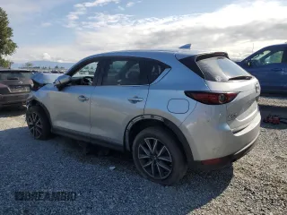 2018 Mazda CX-5 Grand Touring с VIN JM3KFBDM5J0323923, выставлен на аукционе Copart как лот 58162435 с пробегом 144 792 миль миль и Списание • Salvage title. История ставок и продаж доступна на DreamBid. Изображение 2.