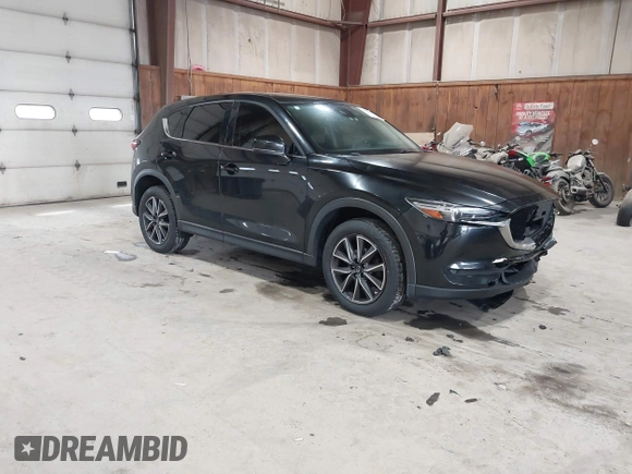 2017 Mazda CX-5 Grand Touring with VIN JM3KFBDL6H0143013, listed as a IAAI auction lot 41912979 with 122,890 mi miles. Bid and sale history available at carsss.com. Image 1.