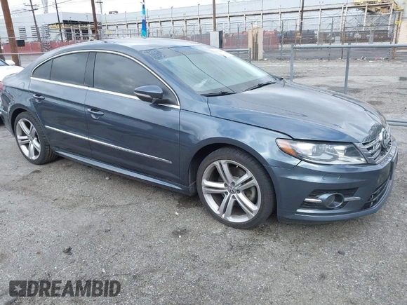 2013 Volkswagen CC Sport with VIN WVWBP7AN3DE571837, listed as a IAAI auction lot 41784447 with 156,834 mi miles. Bid and sale history available at carsss.com. Image 1.