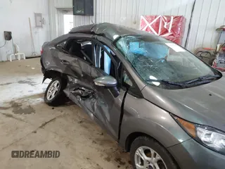 2014 Ford Fiesta SE with VIN 3FADP4BJ9EM117175, listed as a IAAI auction lot 41737432 with 156,141 mi miles. Bid and sale history available at carsss.com. Image 6.