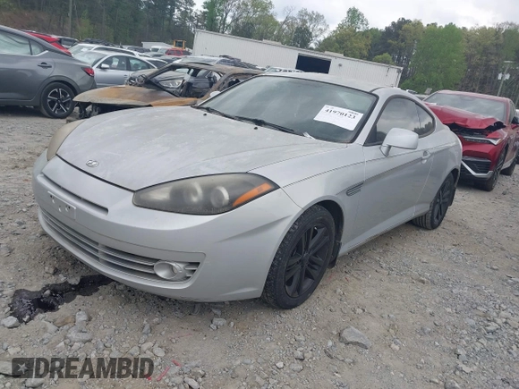 2008 Hyundai Tiburon GS z VIN KMHHM66D68U264666, wystawiony jako IAAI lot #41970123 z przebiegiem 186 448 mil mil oraz . Historia ofert i sprzedaży dostępna na DreamBid. Obrazek 2.