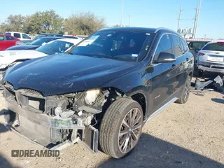 2018 BMW X1 sDrive28i with VIN WBXHU7C30J5L04913, listed as a IAAI auction lot 41755344 with 101,867 mi miles. Bid and sale history available at carsss.com. Image 2.