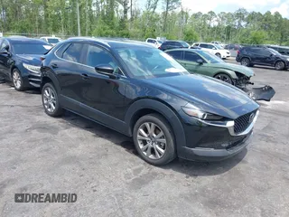 2023 Mazda CX-30 S Carbon Edition z VIN 3MVDMBCM7PM549197, wystawiony jako IAAI lot #42224977 z przebiegiem 22 201 mil mil oraz . Historia ofert i sprzedaży dostępna na DreamBid. Obrazek 1.