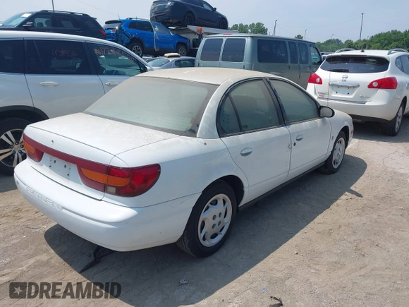2002 Saturn SL z VIN 1G8ZK52772Z218812, wystawiony jako IAAI lot #42763871 z przebiegiem 86 338 mil mil oraz . Historia ofert i sprzedaży dostępna na DreamBid. Obrazek 4.