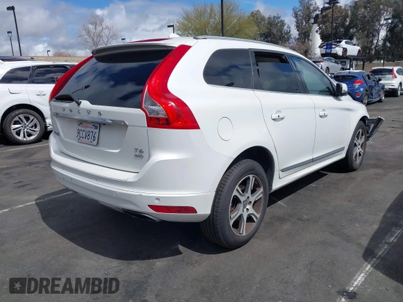 2014 Volvo XC60 R-Design Premier Plus z VIN YV4902DZ5E2554526, wystawiony jako IAAI lot #41764512 z przebiegiem 129 230 mil mil oraz . Historia ofert i sprzedaży dostępna na DreamBid. Obrazek 4.