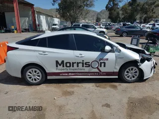 2021 Toyota Prius L Eco with VIN JTDKAMFU8M3133925, listed as a IAAI auction lot 41966660 with 115,193 mi miles. Bid and sale history available at carsss.com. Image 13.