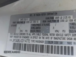 2012 Mazda 5 Sport with VIN JM1CW2BLXC0114770, listed as a IAAI auction lot 42147656 with 99,908 mi miles and . Bid and sale history available at DreamBid. Image 9.