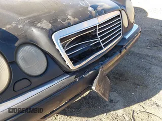 1997 Mercedes-Benz E-Class with VIN WDBJF55F6VJ032691, listed as a IAAI auction lot 40807926 with 215,262 mi miles. Bid and sale history available at carsss.com. Image 6.