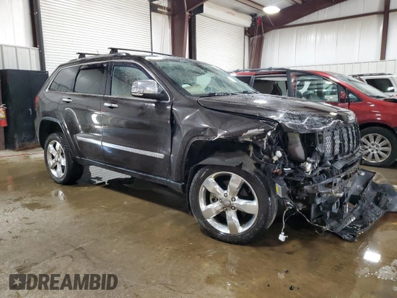 2013 Jeep Grand Cherokee Overland with VIN 1C4RJFCT7DC587329, listed as a Copart auction lot 53432625 with 98,938 mi miles and Salvage Title. Bid and sale history available at carsss.com. Image 4.