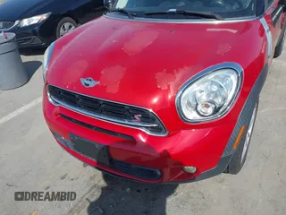 2015 MINI Countryman S z VIN WMWZC3C56FWT06095, wystawiony jako IAAI lot #41856493 z przebiegiem 44 699 mil mil oraz . Historia ofert i sprzedaży dostępna na DreamBid. Obrazek 6.