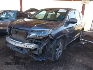 2020 Honda Pilot EX-L with VIN 5FNYF5H50LB011021, listed as a IAAI auction lot 41382249 with 113,884 mi miles. Bid and sale history available at carsss.com. Image 2.