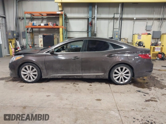 2015 Hyundai Azera Limited z VIN KMHFH4JG2FA432545, wystawiony jako IAAI lot #41329236 z przebiegiem 98 661 mil mil oraz . Historia ofert i sprzedaży dostępna na DreamBid. Obrazek 14.