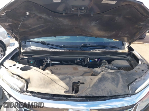 2019 Honda Pilot Touring 7-Passenger z VIN 5FNYF5H65KB020420, wystawiony jako IAAI lot #41575972 z przebiegiem 48 950 mil mil oraz . Historia ofert i sprzedaży dostępna na DreamBid. Obrazek 10.