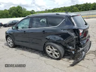 2018 Ford Escape Titanium with VIN 1FMCU0J92JUC84901, listed as a Copart auction lot 60428635 with 69,210 mi miles and Salvage title. Bid and sale history available at DreamBid. Image 2.