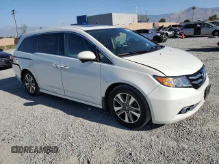 2016 Honda Odyssey Touring Elite with VIN 5FNRL5H9XGB006981, listed as a Copart auction lot 63970385 with 165,164 mi miles and Salvage title. Bid and sale history available at DreamBid. Image 4.