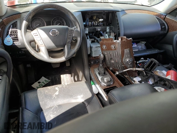 2017 Nissan Armada Platinum z VIN JN8AY2NCXH9504904, wystawiony jako Copart lot #58023935 z przebiegiem Nie podano mil oraz Szkoda całkowita • Salvage title. Historia ofert i sprzedaży dostępna na DreamBid. Obrazek 8.