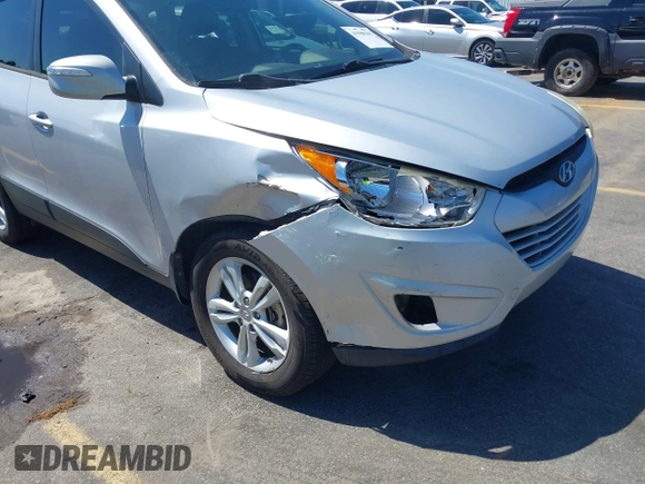 2013 Hyundai Tucson GLS with VIN KM8JU3AC3DU551018, listed as a IAAI auction lot 41988305 with 214,728 mi miles. Bid and sale history available at carsss.com. Image 6.