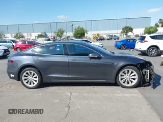 2018 Tesla Model S 75D with VIN 5YJSA1E26JF249573, listed as a IAAI auction lot 42748801 with 88,467 mi miles and . Bid and sale history available at DreamBid. Image 14.