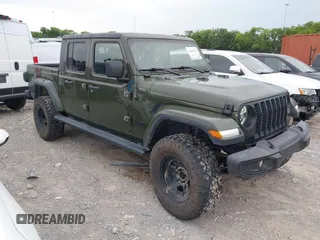 2022 Jeep Gladiator Texas Trail with VIN 1C6HJTAG1NL105124, listed as a IAAI auction lot 42601707 with 52,064 mi miles and . Bid and sale history available at DreamBid. Image 1.