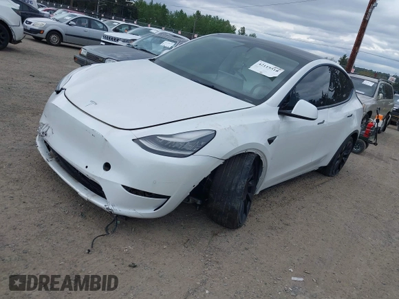 2021 Tesla Model Y Standard Range with VIN 5YJYGDED9MF121828, listed as a IAAI auction lot 42119518 with 34,454 mi miles and . Bid and sale history available at carsss.com. Image 18.