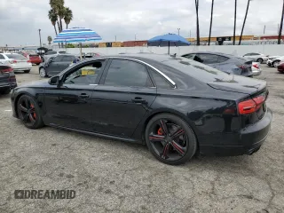 2015 Audi S8 with VIN WAUK2AFD6FN005005, listed as a Copart auction lot 72074884 with 74,335 mi miles and Salvage Title. Bid and sale history available at carsss.com. Image 2.