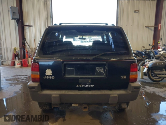 1995 Jeep Grand Cherokee Laredo z VIN 1J4GZ58Y3SC670696, wystawiony jako IAAI lot #42530934 z przebiegiem 165 658 mil mil oraz . Historia ofert i sprzedaży dostępna na DreamBid. Obrazek 16.