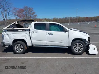 2018 GMC Canyon 4WD SLT z VIN 1GTG6DEN1J1146038, wystawiony jako IAAI lot #42069492 z przebiegiem 63 316 mil mil oraz . Historia ofert i sprzedaży dostępna na DreamBid. Obrazek 13.