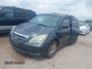 2006 Honda Odyssey LX with VIN 5FNRL38206B120381, listed as a IAAI auction lot 42058872 with 165,217 mi miles. Bid and sale history available at carsss.com. Image 2.