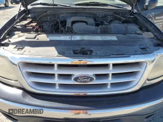 2000 Ford F-150 XL z VIN 1FTRX18L5YNA10836, wystawiony jako Copart lot #55325245 z przebiegiem 188 237 mil mil oraz Szkoda całkowita • Salvage title. Historia ofert i sprzedaży dostępna na DreamBid. Obrazek 11.