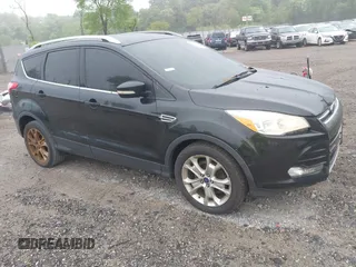 2014 Ford Escape Titanium with VIN 1FMCU9J90EUC24898, listed as a IAAI auction lot 42166523 with 152,464 mi miles and . Bid and sale history available at DreamBid. Image 1.