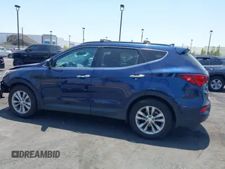 2018 Hyundai Santa Fe 2.0T z VIN 5XYZU4LA8JG537427, wystawiony jako IAAI lot #42349692 z przebiegiem 148 764 mil mil oraz . Historia ofert i sprzedaży dostępna na DreamBid. Obrazek 14.