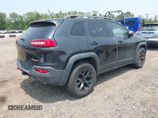 2014 Jeep Cherokee Trailhawk with VIN 1C4PJMBS8EW285276, listed as a IAAI auction lot 42408796 with Not provided miles and . Bid and sale history available at DreamBid. Image 4.