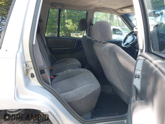 1998 Jeep Grand Cherokee Laredo with VIN 1J4GZ58S6WC154415, listed as a IAAI auction lot 42331831 with 163,723 mi miles and . Bid and sale history available at DreamBid. Image 8.