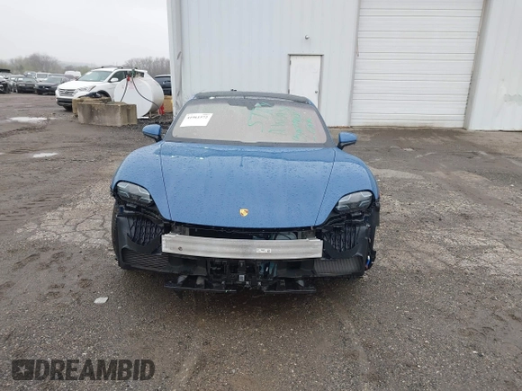 2022 Porsche Taycan GTS z VIN WP0AD2Y17NSA59692, wystawiony jako IAAI lot #41961572 z przebiegiem 12 680 mil mil oraz . Historia ofert i sprzedaży dostępna na DreamBid. Obrazek 13.