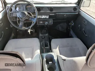 1987 Suzuki Samurai z VIN JS3JC51C3H4186141, wystawiony jako Copart lot #72551804 z przebiegiem 525 030 mil mil oraz Szkody całkowita. Historia ofert i sprzedaży dostępna na DreamBid. Obrazek 8.