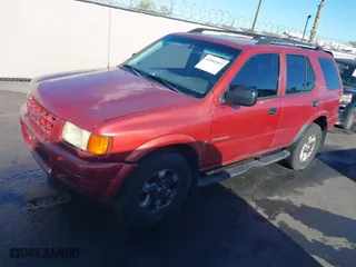 1999 Isuzu Rodeo S with VIN 4S2CK58W3X4307201, listed as a IAAI auction lot 41884901 with 236,970 mi miles. Bid and sale history available at carsss.com. Image 2.