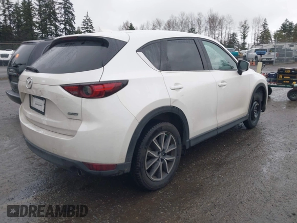 2017 Mazda CX-5 Grand Touring with VIN JM3KFBDL5H0148574, listed as a IAAI auction lot 41867827 with 32,382 mi miles. Bid and sale history available at carsss.com. Image 4.