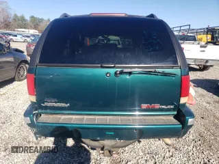 1997 GMC Jimmy SL with VIN 1GKCS13W2V2518446, listed as a Copart auction lot 86629634 with 183,089 mi miles and Salvage Title. Bid and sale history available at carsss.com. Image 6.