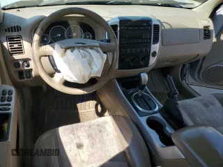 2005 Mercury Mariner Luxury z VIN 4M2YU56165DJ21260, wystawiony jako Copart lot #67528354 z przebiegiem Nie podano mil oraz Szkoda całkowita • Salvage title. Historia ofert i sprzedaży dostępna na DreamBid. Obrazek 8.