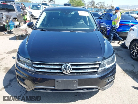 2021 Volkswagen Tiguan SE with VIN 3VV3B7AX1MM045478, listed as a IAAI auction lot 41947899 with 56,694 mi miles and . Bid and sale history available at DreamBid. Image 12.