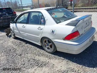 2002 Mitsubishi Lancer OZ-Rally with VIN JA3AJ86E42U039140, listed as a IAAI auction lot 41853888 with 328,181 mi miles. Bid and sale history available at carsss.com. Image 3.