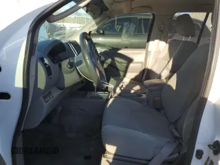 2010 Nissan Frontier LE with VIN 1N6AD0EV9AC422407, listed as a Copart auction lot 87938905 with 164,025 mi miles and Salvage title. Bid and sale history available at DreamBid. Image 7.