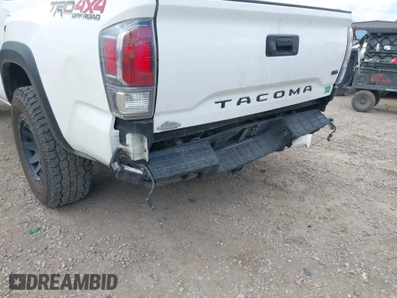 2022 Toyota Tacoma SR with VIN 3TMCZ5AN1NM478457, listed as a IAAI auction lot 42479107 with 59,547 mi miles and . Bid and sale history available at DreamBid. Image 6.