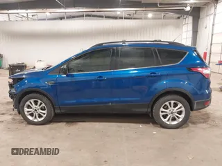 2017 Ford Escape SE z VIN 1FMCU0G90HUA94581, wystawiony jako IAAI lot #41396965 z przebiegiem 104 978 mil mil oraz . Historia ofert i sprzedaży dostępna na DreamBid. Obrazek 14.