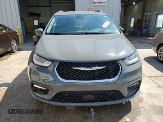 2021 Chrysler Pacifica Hybrid Touring L with VIN 2C4RC1L72MR599413, listed as a Copart auction lot 56419875 with 108,986 mi miles and Salvage title. Bid and sale history available at DreamBid. Image 5.