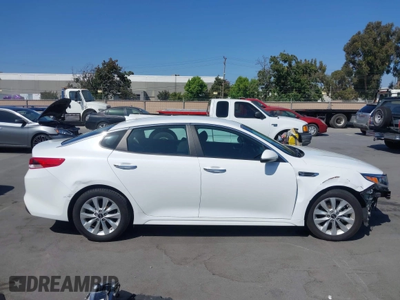 2018 Kia Optima LX z VIN 5XXGT4L35JG265371, wystawiony jako IAAI lot #42494354 z przebiegiem 86 411 mil mil oraz . Historia ofert i sprzedaży dostępna na DreamBid. Obrazek 14.