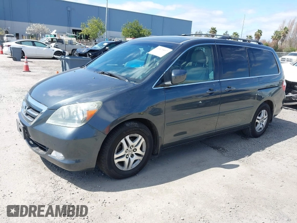 2005 Honda Odyssey TOURING with VIN 5FNRL38885B082482, listed as a IAAI auction lot 41879897 with 159,667 mi miles. Bid and sale history available at carsss.com. Image 17.
